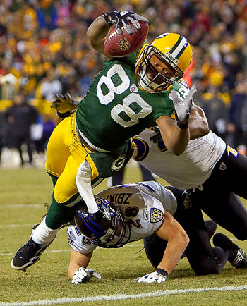 Green Bay Packers tight end Jermichael Finley scores a touchdown against the Baltimore Ravens.