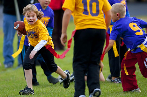 Youth flag football in Green Bay, Wisconsin.  The ball carrier is my niece Izzy.