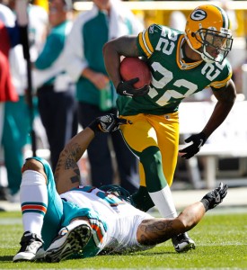 Miami Dolphins linebacker Ikaika Alama-Francis takes down Green Bay Packers cornerback Pat Lee.