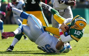 Detroit Lions defensive tackle Ndamukong Suh sacks Green Bay Packers quarterback Aaron Rodgers.