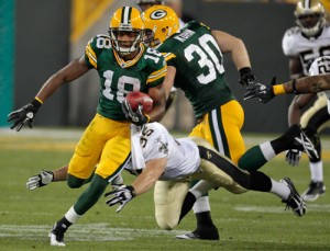 Green Bay Packers wide receiver Randall Cobb on his way to a 108 yard kickoff return for a touchdown and a a tie for an NFL record.