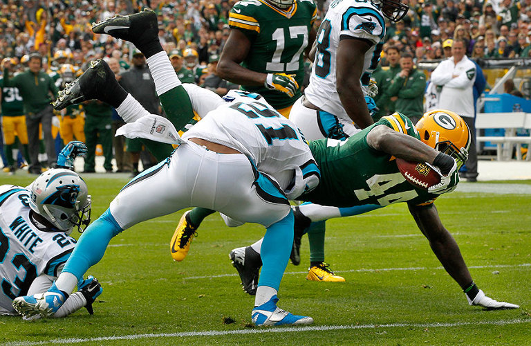 Green Bay Packers running back James Starks dives in to the end zone for a touchdown.