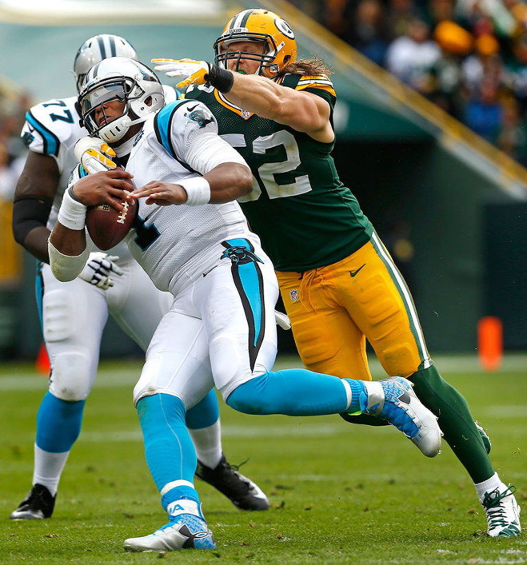 Carolina Panthers quarterback Cam Newton escapes the pressure of Green Bay Packers outside linebacker Clay Matthews.
