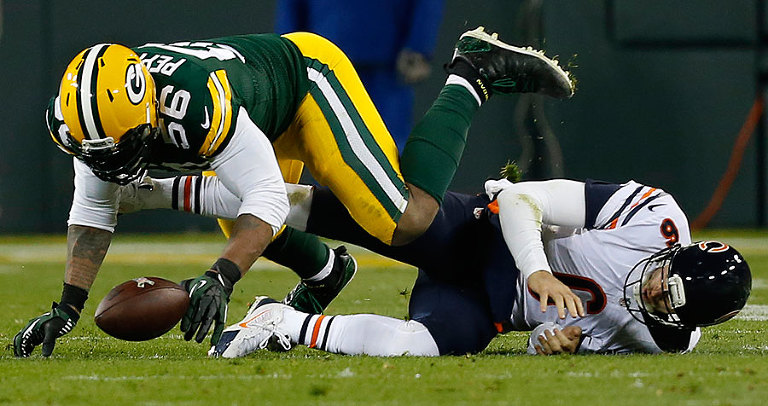 Green Bay Packers outside linebacker Julius Peppers recovers a Chicago Bears quarterback Jay Cutler fumble.