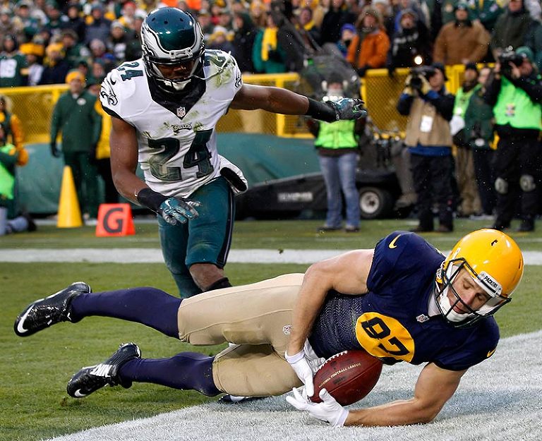 Green Bay Packers wide receiver Jordy Nelson tires to pull in a pass in the end zone as Philadelphia Eagles cornerback Bradley Fletcher defends.