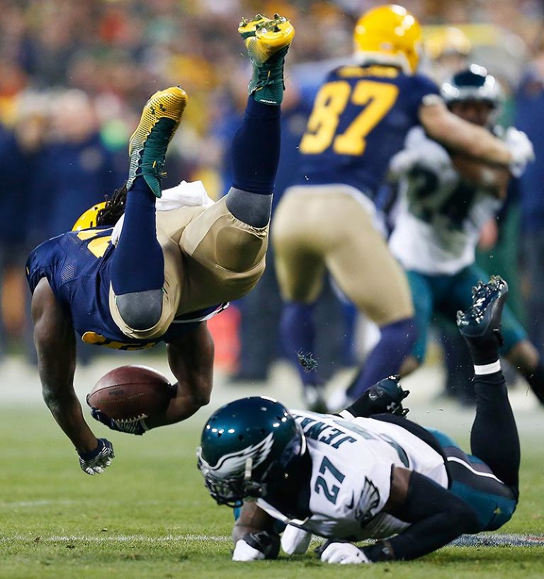 Philadelphia Eagles free safety Malcolm Jenkins upends Green Bay Packers running back Eddie Lacy.