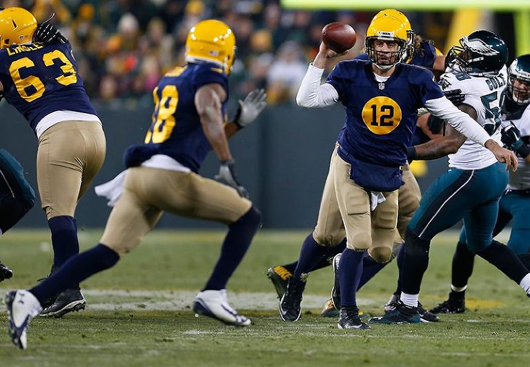 Green Bay Packers quarterback Aaron Rodgers throws a pass to Randall Cobb.