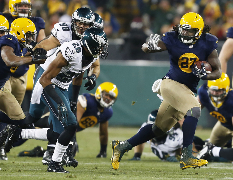 Green Bay Packers running back Eddie Lacy runs aways form the Philadelphia Eagles defense.