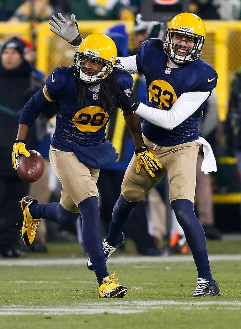 Green Bay Packers cornerback Tramon Williams celebrates his interception with free safety Micah Hyde.