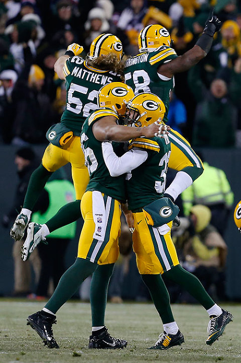 The Green Bay Packers defense celebrates a defense stop late in the game.