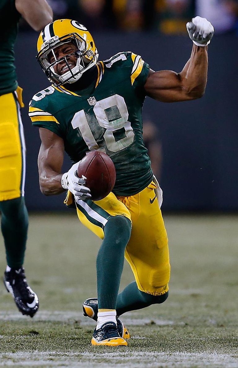 Green Bay Packers wide receiver Randall Cobb celebrates a pass for a first down to help clinch the Packers win over the Patriots