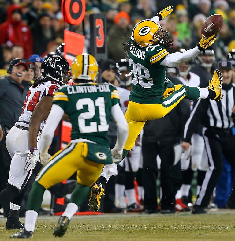 Green Bay Packers cornerback Tramon Williams bats away a pass intended for Atlanta Falcons wide receiver Roddy White.