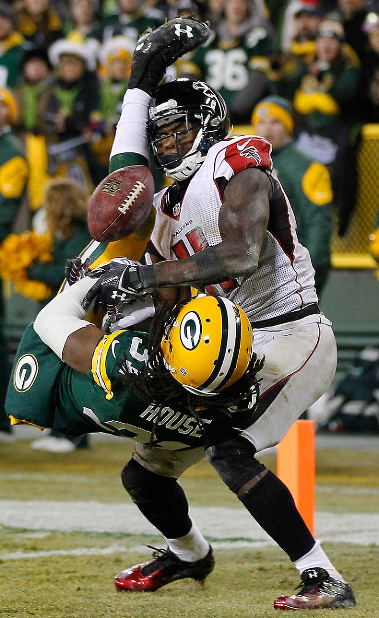 Green Bay Packers cornerback Davon House defends a pass intended for Atlanta Falcons wide receiver Julio Jones in the end zone.