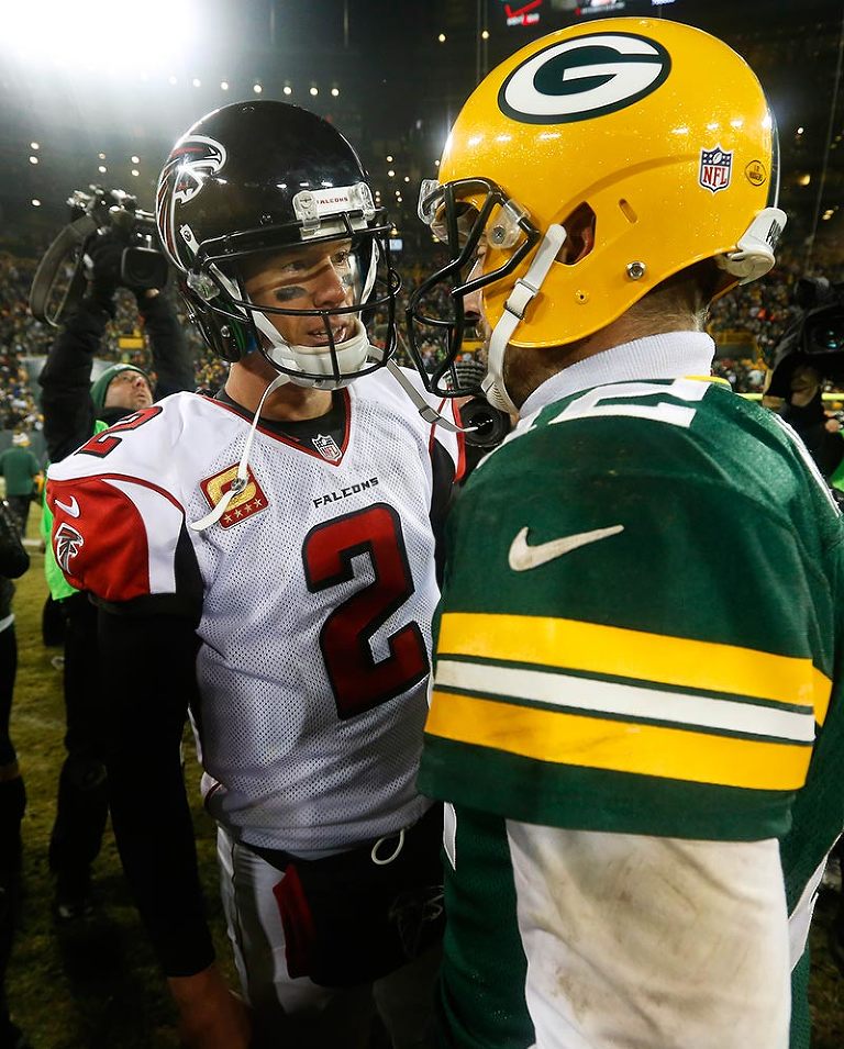 Atlanta Falcons quarterback Matt Ryan and Green Bay Packers quarterback Aaron Rodgers talk after the game.