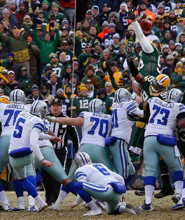 Green Bay Packers defensive end Datone Jones blocks a field goal by Dallas Cowboys kicker Dan Bailey.