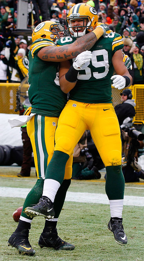 Green Bay Packers tight end Richard Rodgers celebrates his touchdown with tight end Andrew Quarless.