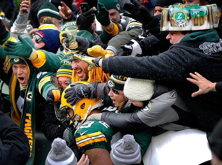 Green Bay Packers tight end Richard Rodgers gets little beer shower while celebrating his touchdown.
