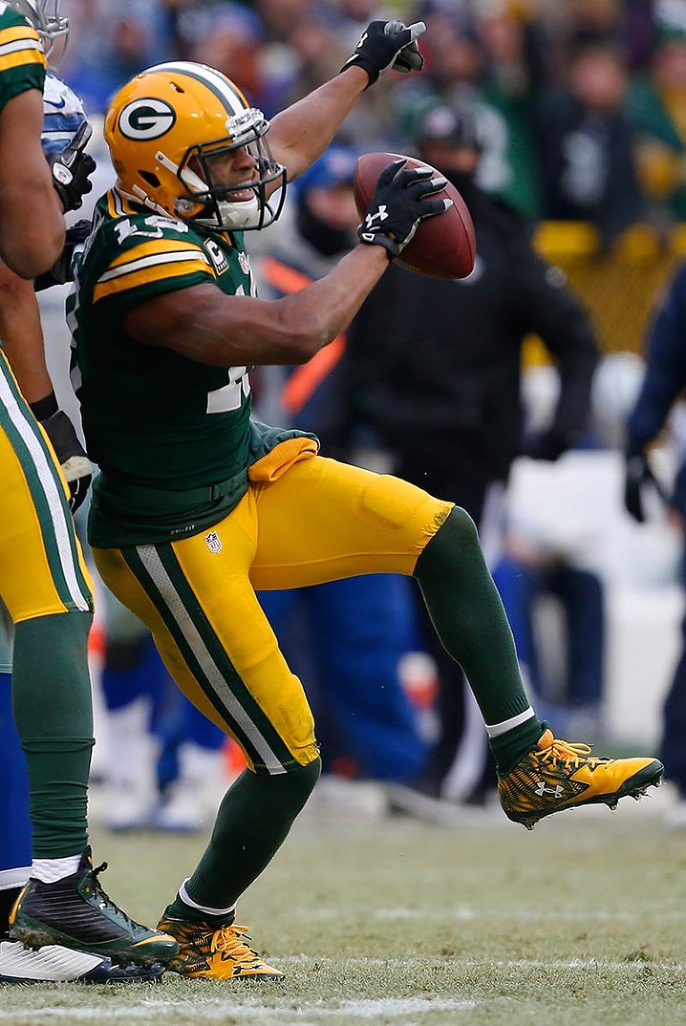 Green Bay Packers wide receiver Randall Cobb celebrates a first down catch that allowed the Packers to run out the clock to win the game.