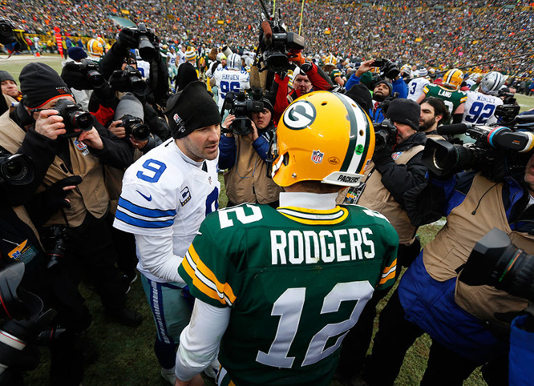 Dallas Cowboys quarterback Tony Romo and Green Bay Packers quarterback Aaron Rodgers shake hand after the Packers defeated the Cowboys in the divisional round of the NFL playoffs.
