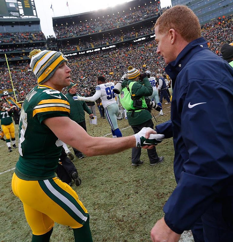 Green Bay Packers wide receiver Jordy Nelson shakes hands with Dallas Cowboys head coach Jason Garrett.