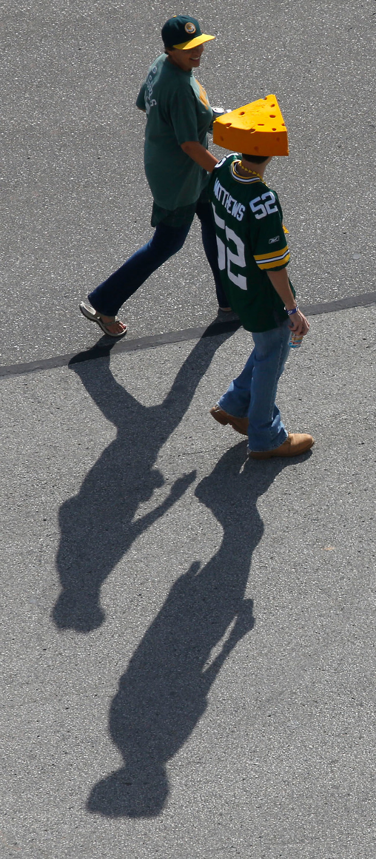 Green Bay Packers fans walk around the stadium before the game.