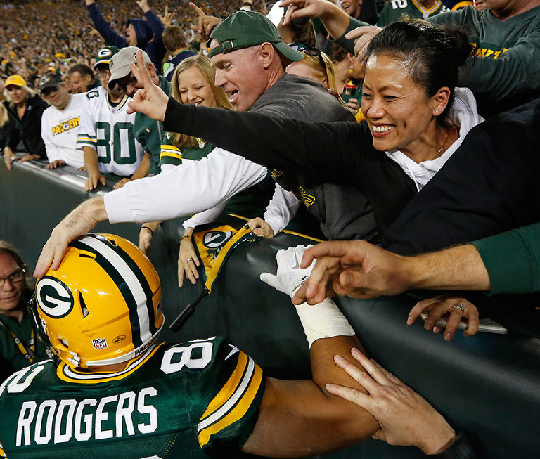 Green Bay Packers tight end Richard Rodgers celebrates his touchdown with fans.