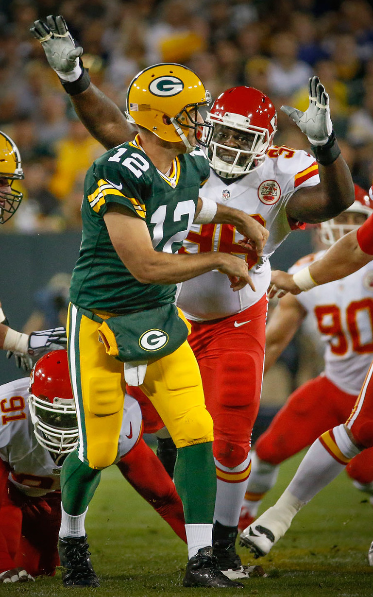 Kansas City Chiefs nose tackle Jaye Howard chases after Green Bay Packers quarterback Aaron Rodgers.