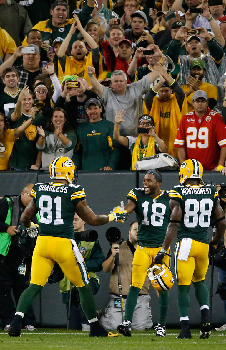 Green Bay Packers wide receiver Randall Cobb celebrates one of his three touchdowns with his teammates.