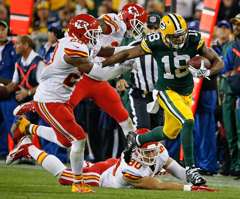 Green Bay Packers wide receiver Randall Cobb breaks away from the Kansas City Chiefs defense for long gain.