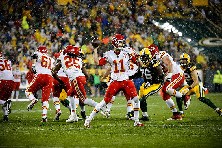 Kansas City Chiefs quarterback Alex Smith looks for a receiver during one of the heaviest periods of rain.