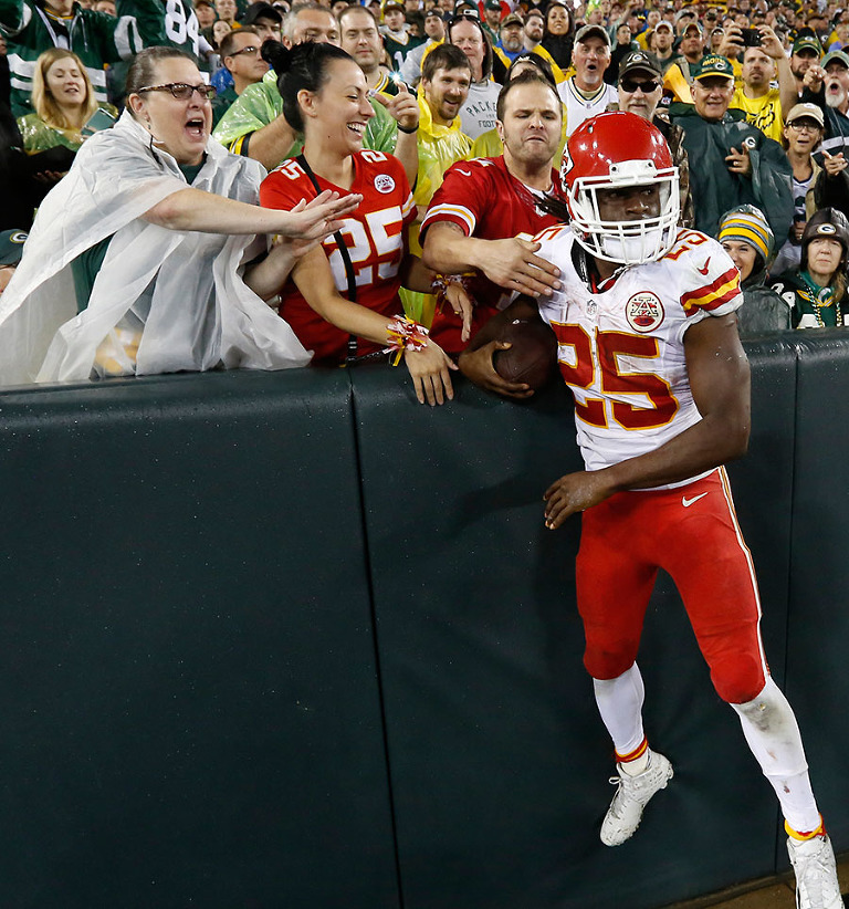 Kansas City Chiefs running back Jamaal Charles celebrates with Chiefs fans after scoring a touchdown.