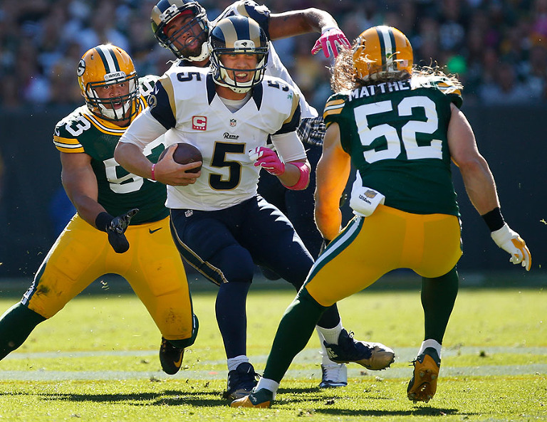 Green Bay Packers outside linebacker Nick Perry, left, and inside linebacker Clay Matthews pressure St. Louis Rams quarterback Nick Foles.
