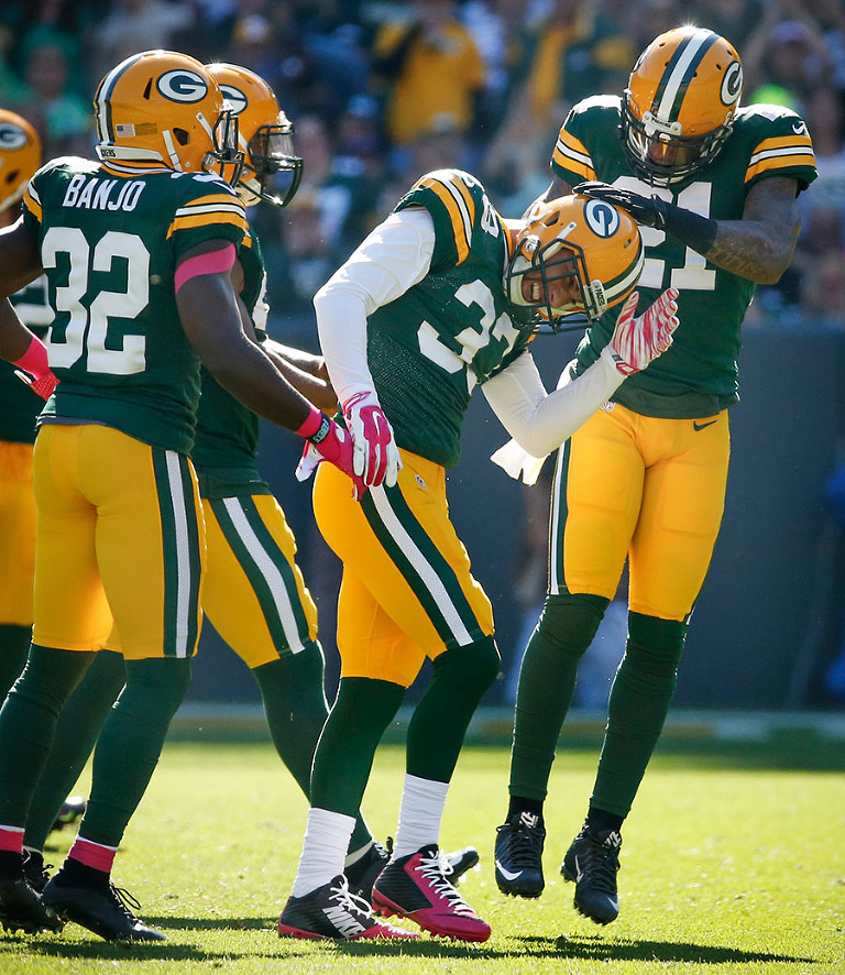 Green Bay Packers strong safety Micah Hyde celebrates his interception with his teammates.