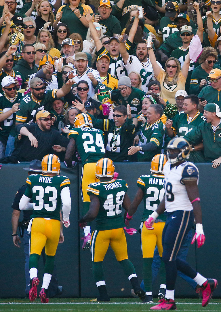 Green Bay Packers cornerback Quinten Rollins does a Lambeau Leap to celebrate on of his two interceptions.