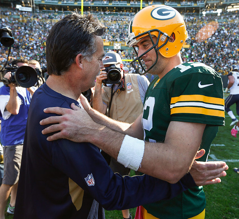 St. Louis Rams head coach Jeff Fisher shakes hands with Green Bay Packers quarterback Aaron Rodgers after the Packers defeated the Rams 24-10.
