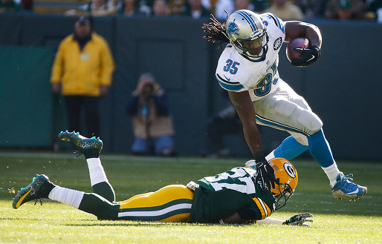 Green Bay Packers cornerback Sam Shields defends Detroit Lions running back Joique Bell.