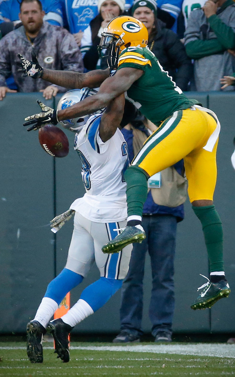 Detroit Lions cornerback Quandre Diggs defends a pass intended for Green Bay Packers wide receiver Davante Adams.