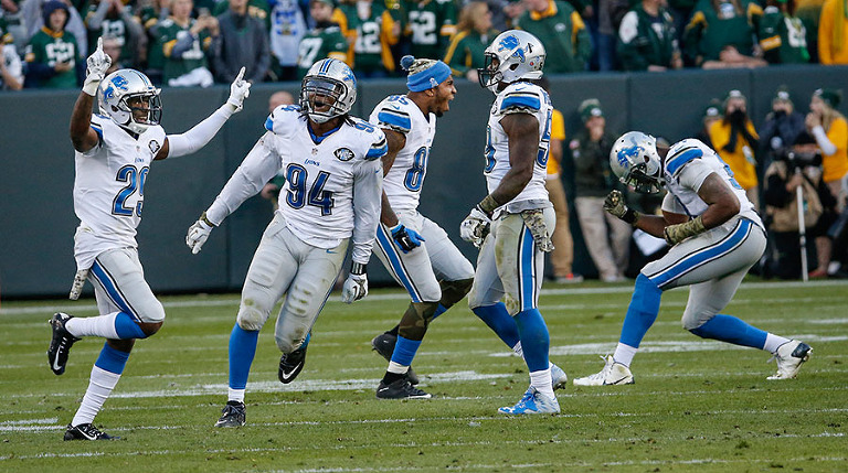 Detroit Lions players celebrate after Green Bay Packers kicker Mason Crosby missed a field goal in the final seconds.