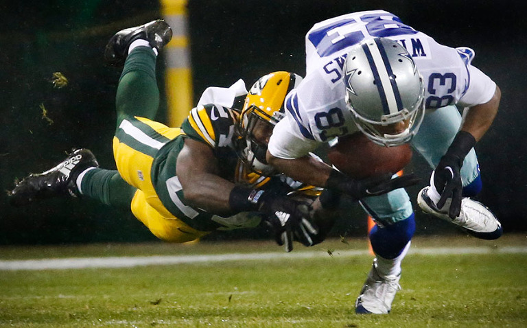 Green Bay Packers cornerback Quinten Rollins takes down Dallas Cowboys wide receiver Terrance Williams.