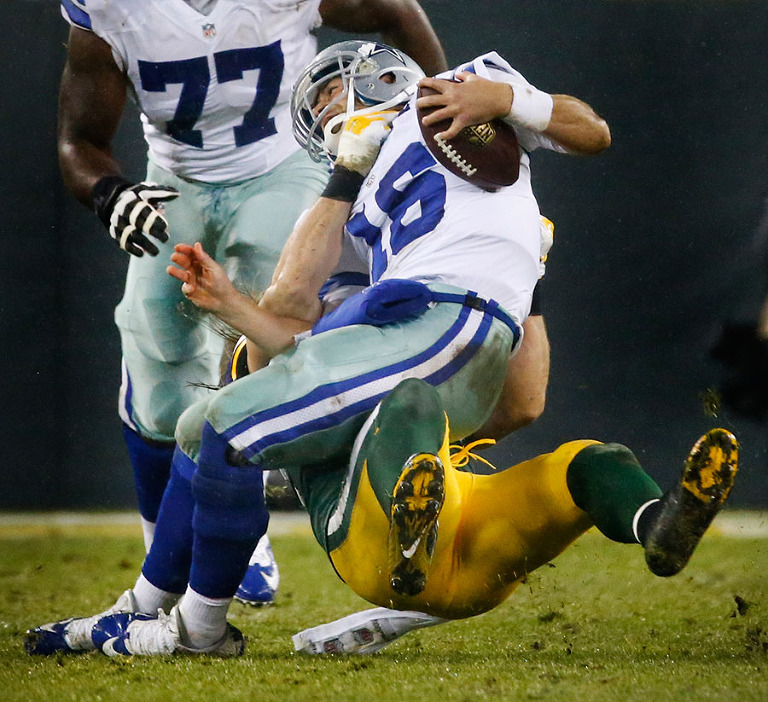 Green Bay Packers inside linebacker Clay Matthews sacks Dallas Cowboys quarterback Matt Cassel.