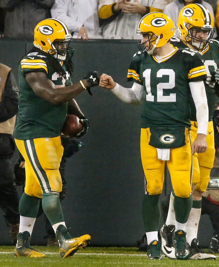 Green Bay Packers running back Eddie Lacy gets congratulated on his touchdown by quarterback Aaron Rodgers.