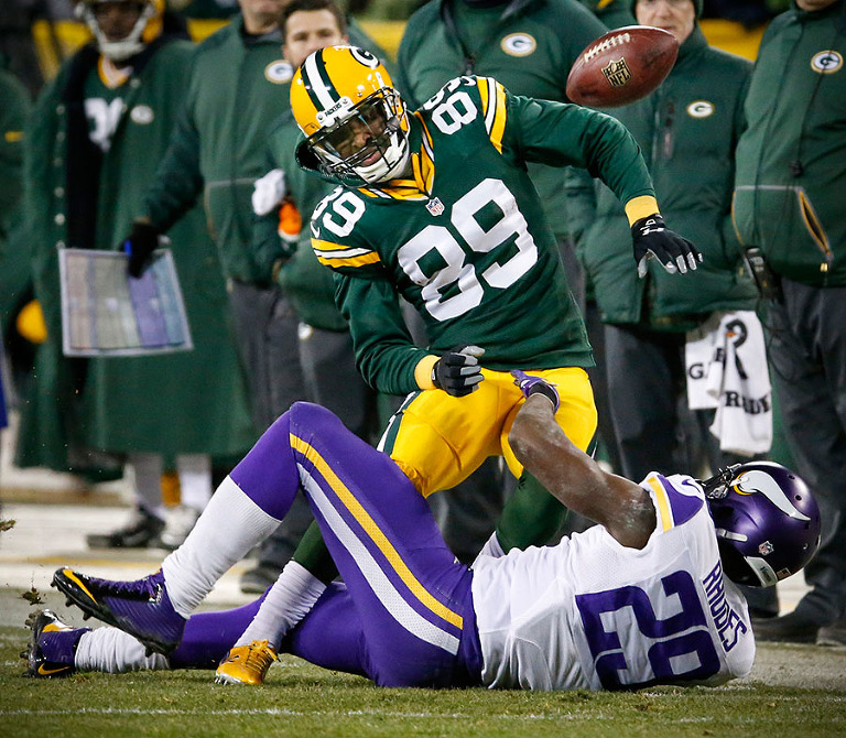 Minnesota Vikings cornerback Xavier Rhodes defends a pass intended for Green Bay Packers wide receiver James Jones.