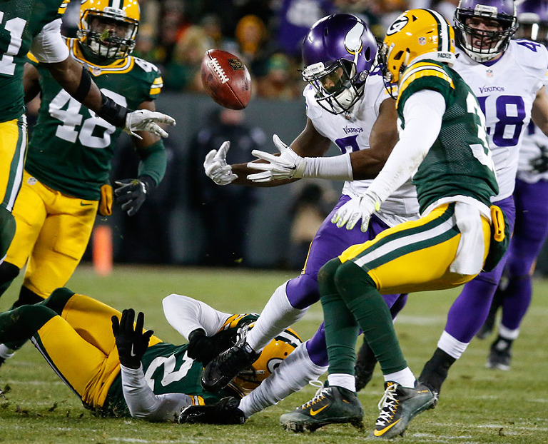 Green Bay Packers kicker Mason Crosby strips Minnesota Vikings wide receiver Cordarrelle Patterson of the ball on a kickoff return.