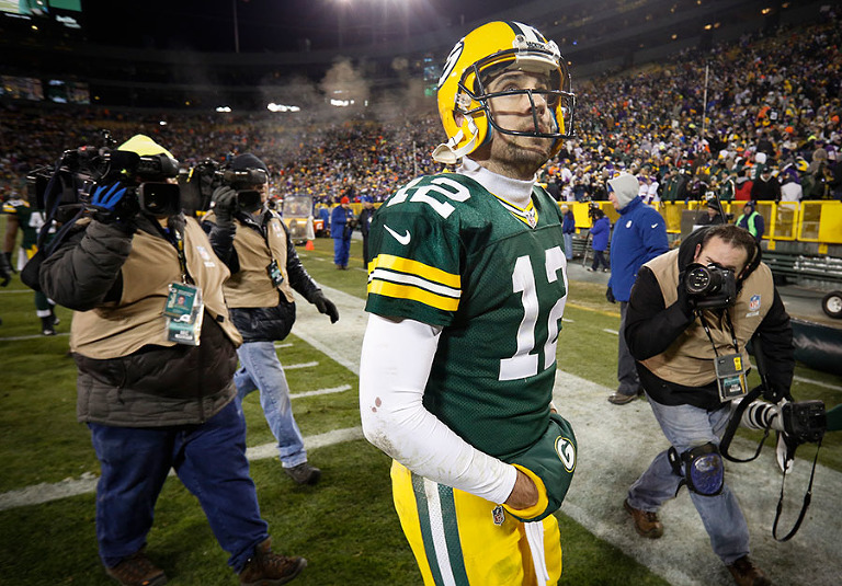 Green Bay Packers quarterback Aaron Rodgers walks off the field after being defeated 20-13 by the Minnesota Vikings.