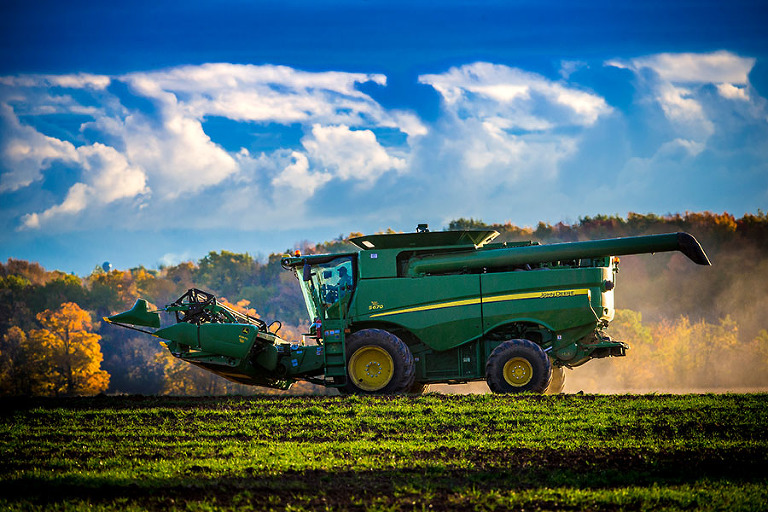 A combine heads out to take on a days work near Chilton, Wisconsin.