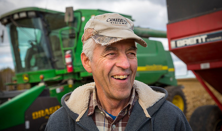 A farmer takes a break from combining near Chilton, Wisconsin.