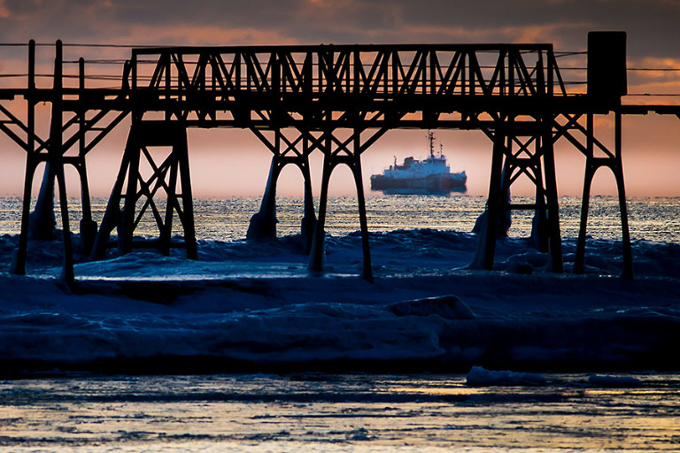Sunrise on Lake Michigan as the Coast Guard Mobile Bay heads in to Sturgeon Bay, Wisconsin.