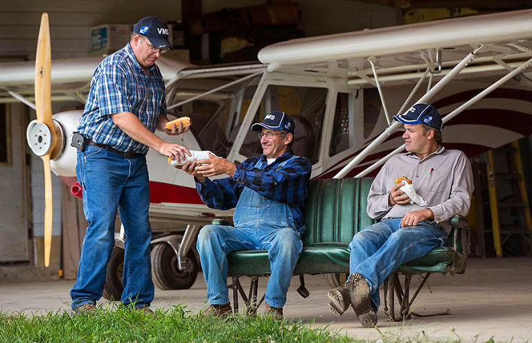 A lunch time break for a father and his two sons that he farms with in southwestern Wisconsin as part of a day in the life project for an agriculture client.