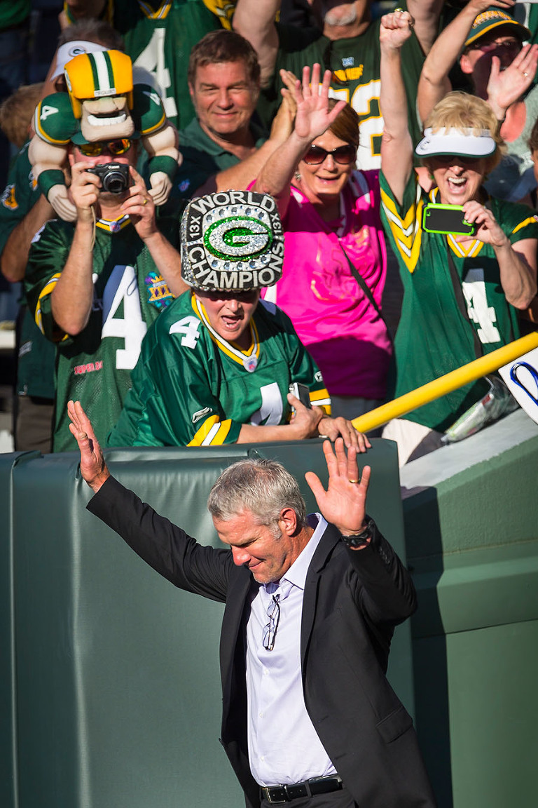 Former Green Bay Packers quarterback Brett Favre walks out on to Lambeau Field during his induction in to the Packers Hall of Fame.