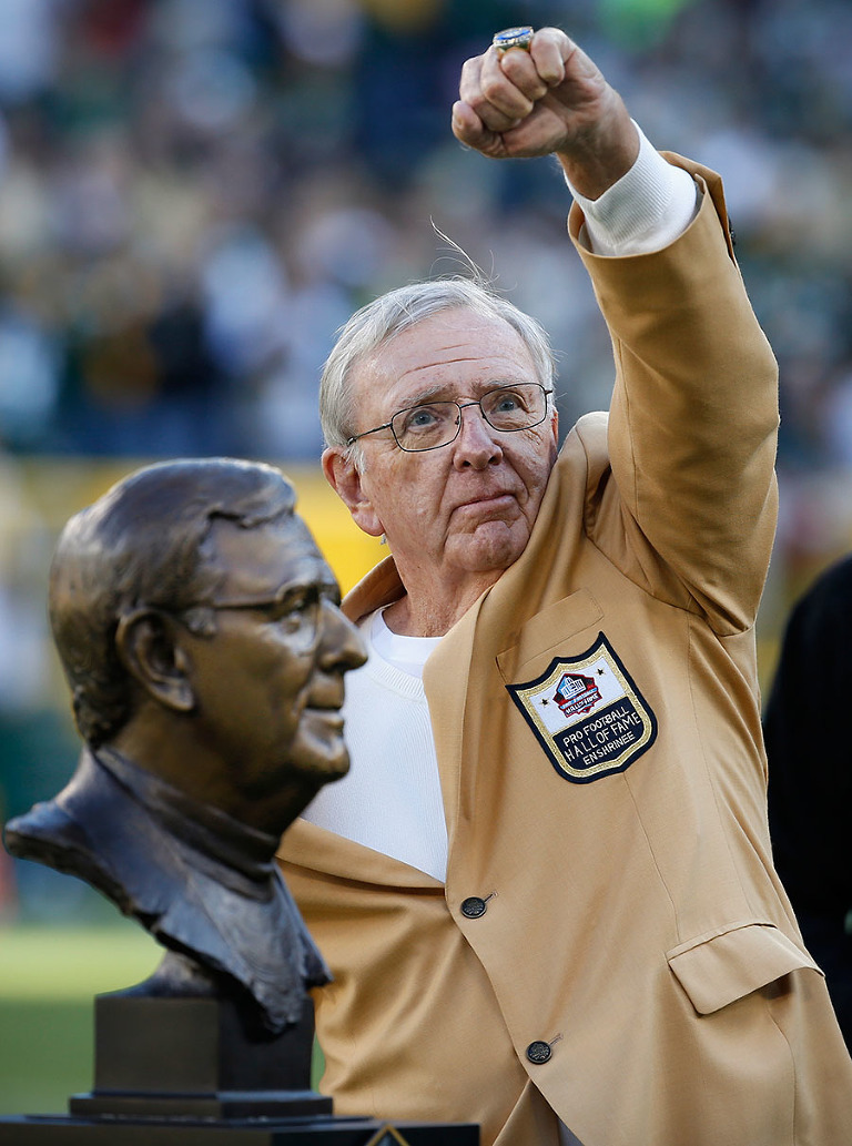 Former Green Bay Packers general manager Ron Wolf shows off his Green Bay Packers Hall of Fame ring during a halftime ceremony.
